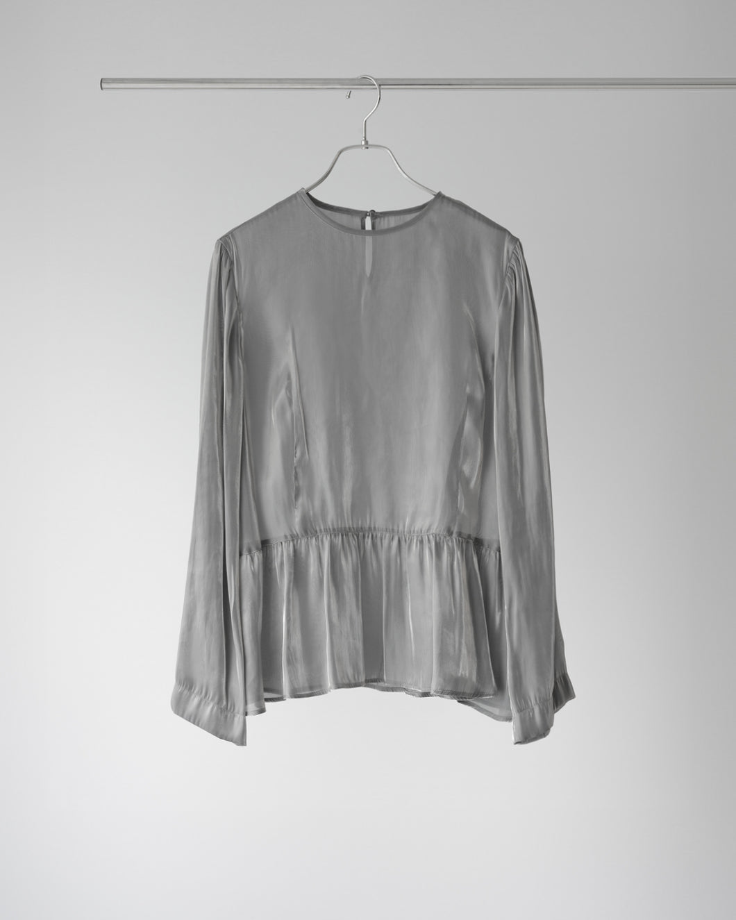 Platinum satin peplum blouse